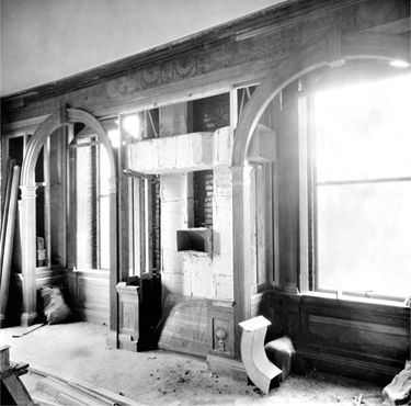 A photograph of the installation of the Petersburg room in The Met in 1925.