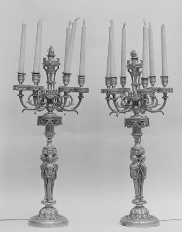 A pair of gilded bronze candelabra donated by members of the Committee of the Bertha King Benkard Memorial Fund