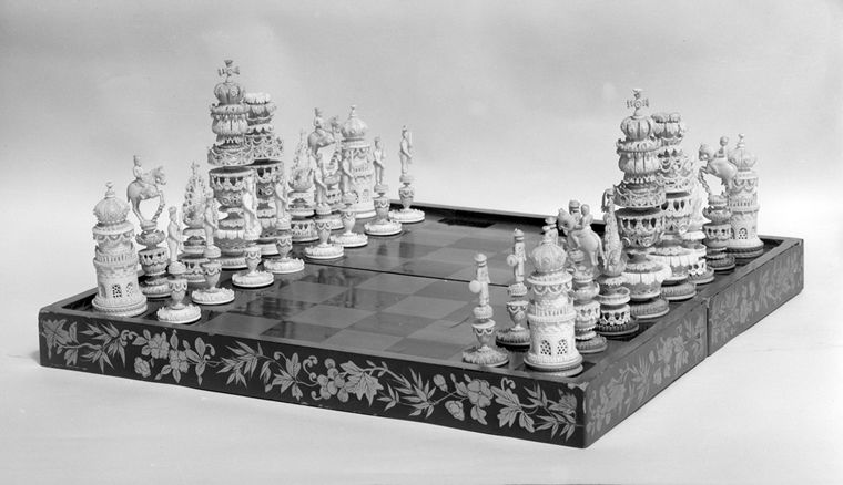 Photograph of a wood and ivory chess set gifted to the museum by members of the Committee of the Bertha King Benkard Memorial Fund