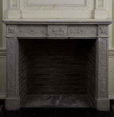 The carved marble mantel, added to the fireplace currently installed in the Benkard Room in 1810
