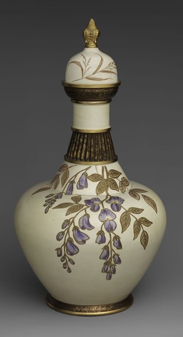 Earthenware ceramic vase decorated with purple and gold details of flowers