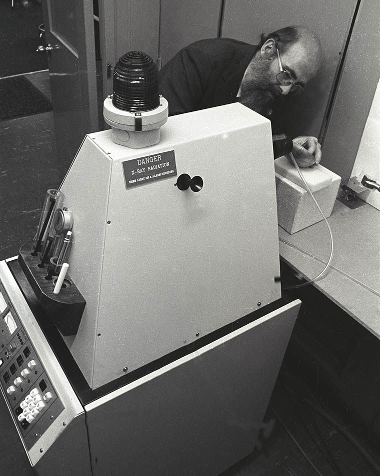 A conservator using the Museum's first X-ray fluorescence spectrometer