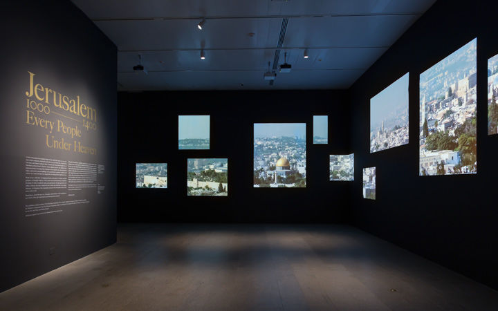 View of the entrance gallery showing the title wall and a number of photographs of modern-day Jerusalem