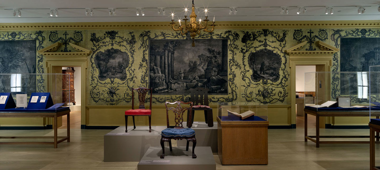 View of a museum gallery displaying furniture designs and British and American furniture from the 18th and 19th centuries