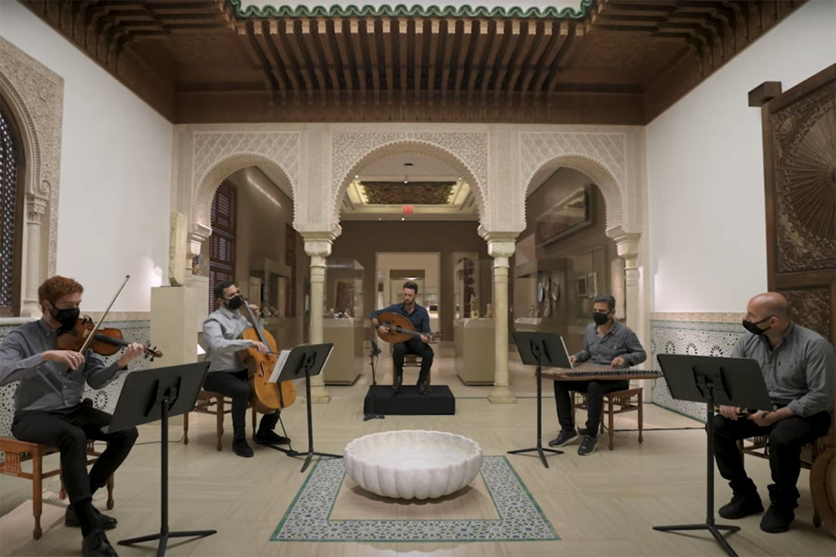 Image of an ensemble playing in The Met's Islamic Gallery's Moroccan Court. 