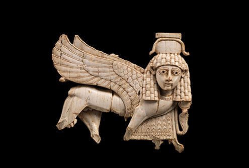 Openwork ivory plaque with striding sphinx