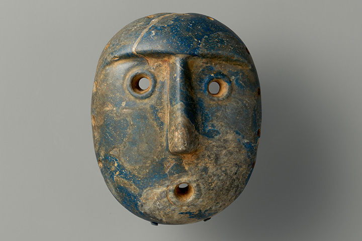 Stone mask carved into lapis lazuli, made by a Condorhuasi-Alamito artist. 
