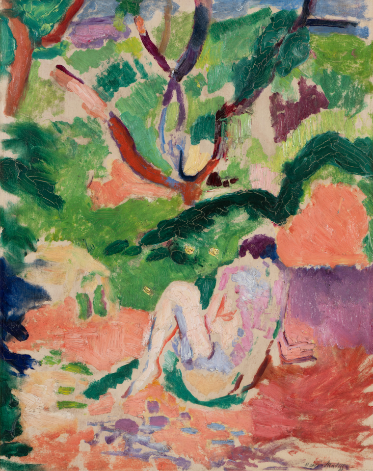 nude person sitting in a colorful forest