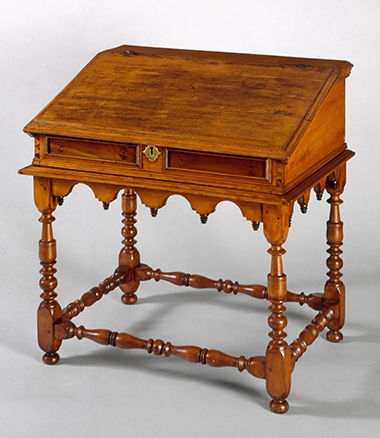Early 18th century wooden desk with an angled surface.