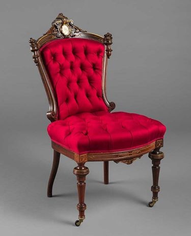 Tufted, bright red side chair with gilt bronze mounts, gilded incised line decoration, and inset medallion of carved mother-of-pearl.