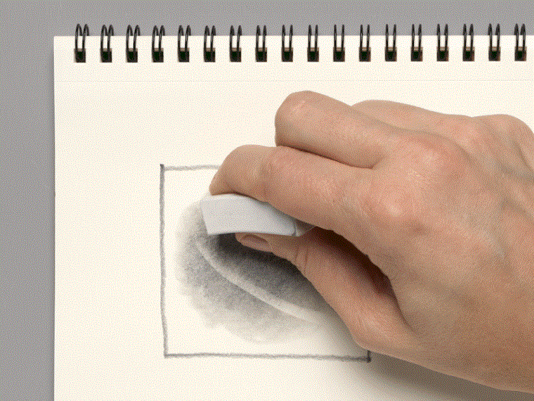 A moving image of a hand using an eraser to lighten pencil marks.