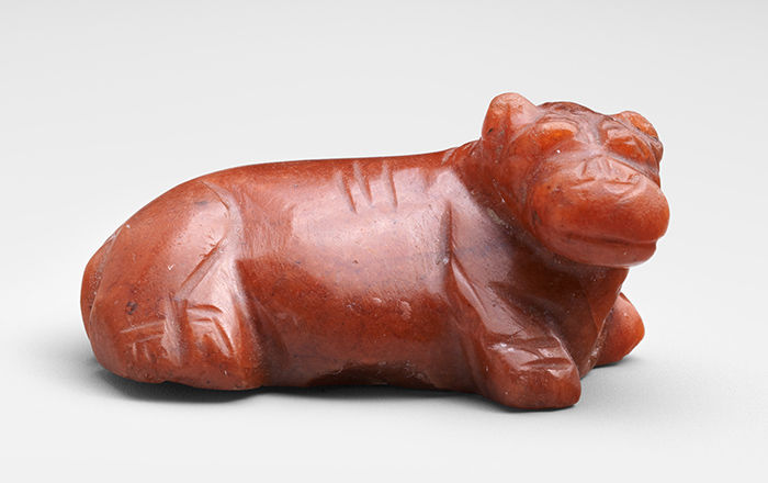 Small red jasper hippo lying down