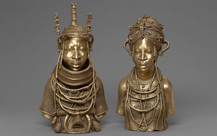 Two contemporary brilliantly cast brass sculptures of a man and woman from Benin
