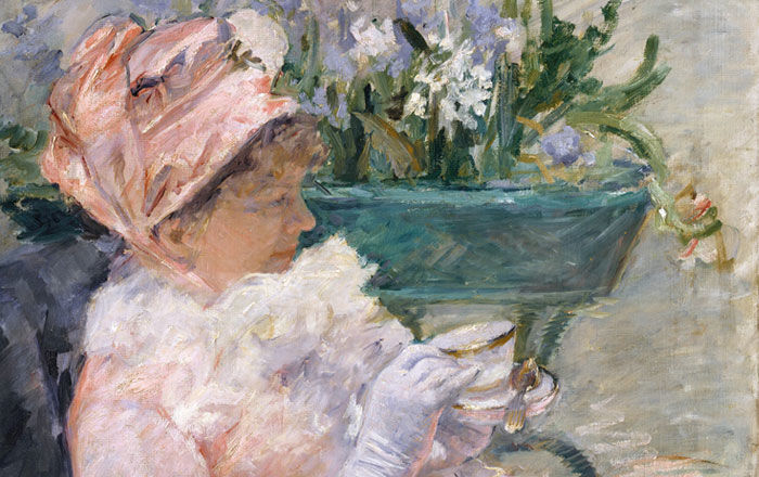 Detail of an Impressionist painting by Mary Cassatt of a woman wearing a pink dress and hat drinking tea