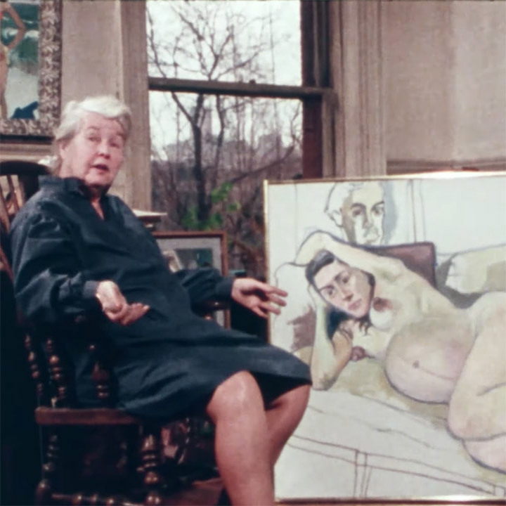 Alice Neel seated in a chair in front of a large painting of a nude pregnant woman