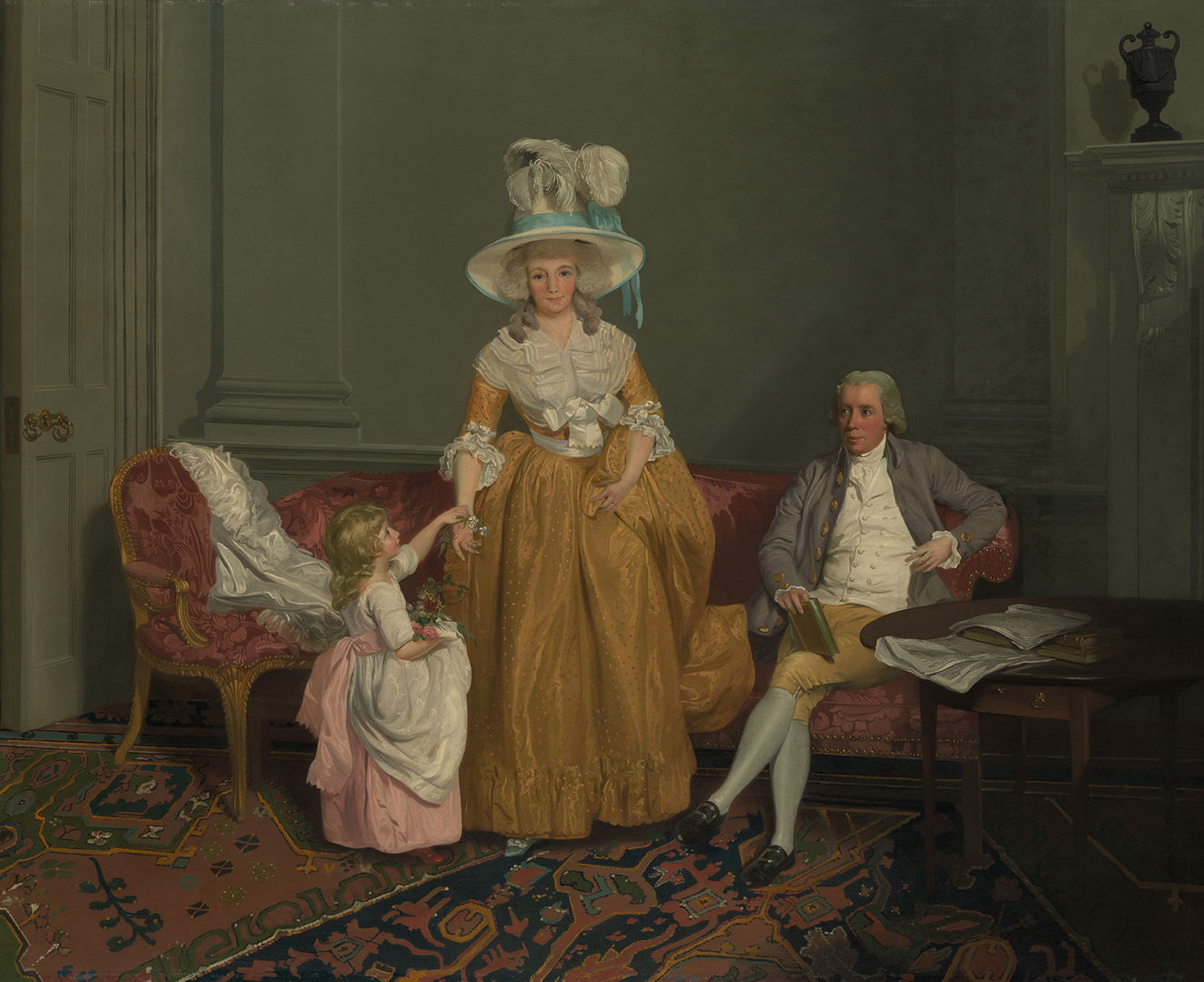 Francis Wheatley’s portrait of the Saithwaite family which depicts a mother in the center, a father sitting next to her on a couch, and their your child to the left of the woman. 