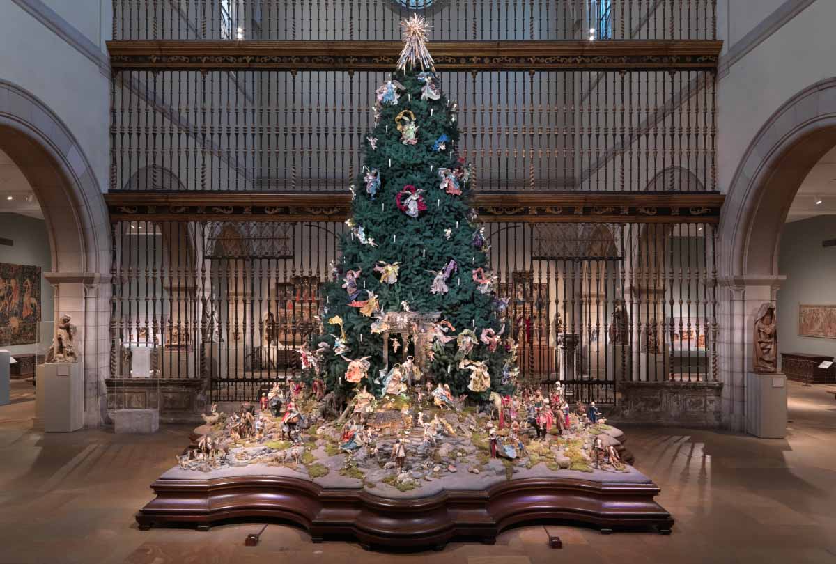 An ornate Christmas tree on view in the Medieval Hall at The Met Fifth Avenue