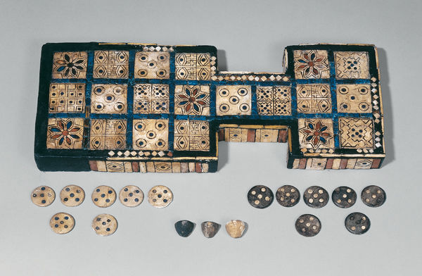 Royal Game of Ur with gaming pieces and tetrahedrons, ca. 2600 BC. The Trustees of the British Museum