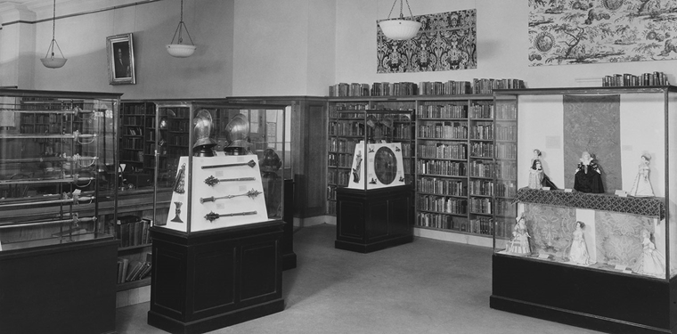 Archival photograph of “Arms, Armor, and Textiles: 1492-1776,” at the George Bruce Branch, New York Public Library, 518 West 125th Street, Manhattan, 1934