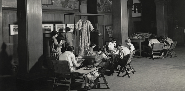 Archival photograph of "Oriental Prints and Textiles," with students, at Washington Irving High School, 40 Irving Place, New York, NY, 1935
