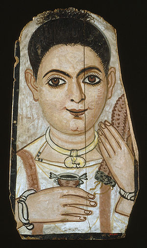 Portrait of a girl holding a cup and a garland