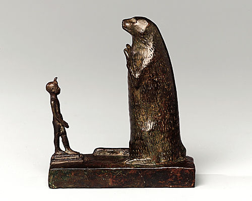           Group with King Holding a <i>Shen-ring</i> (?) before an Otter        