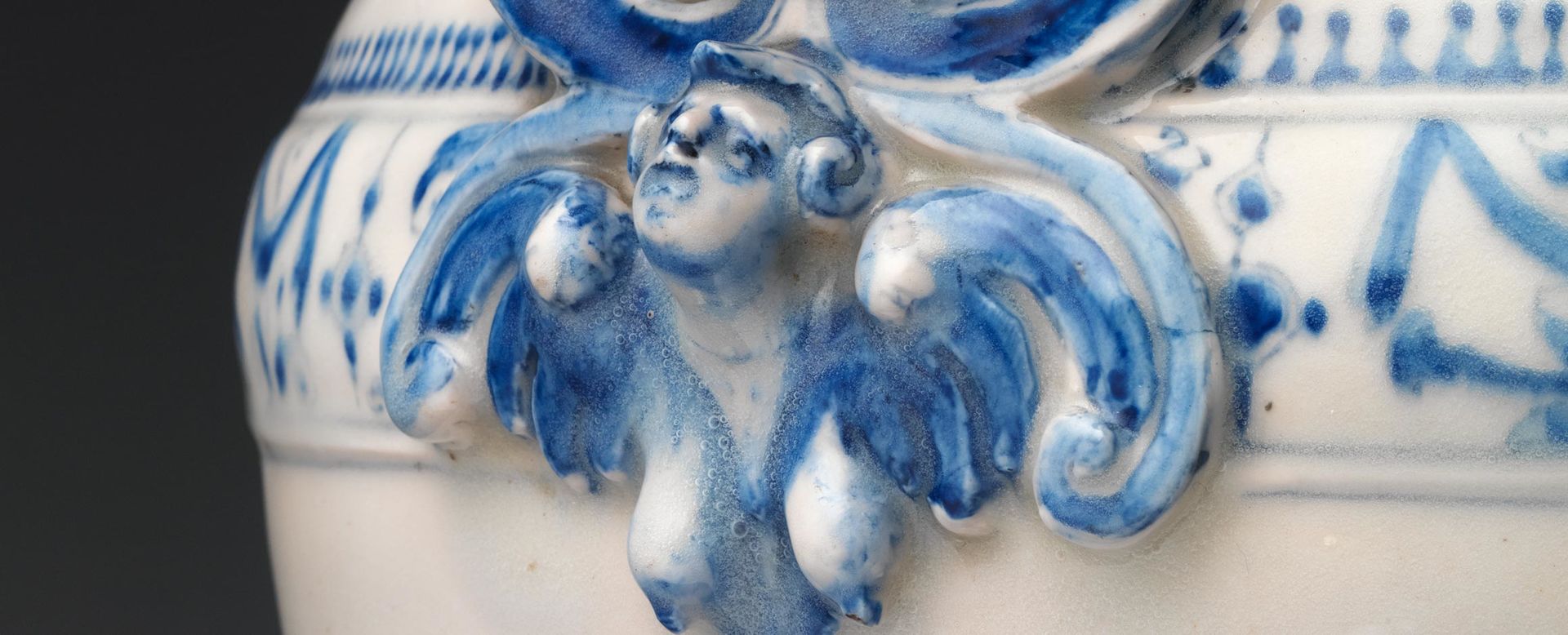 Detail of a blue and white handle from an Italian ewer made of porcelain