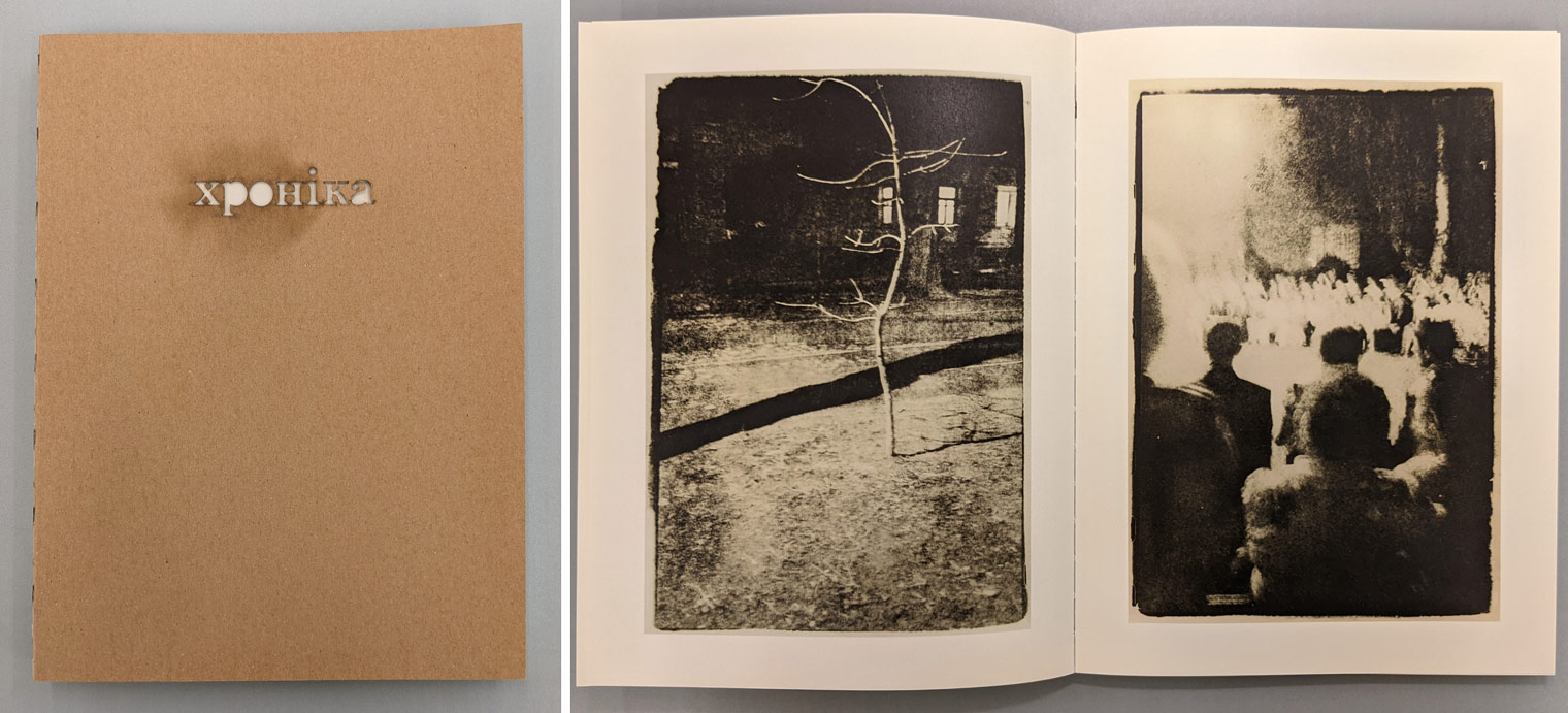Book with laser-cut cover titled Хроніка next to open book showing two black and white photographs of street scenes