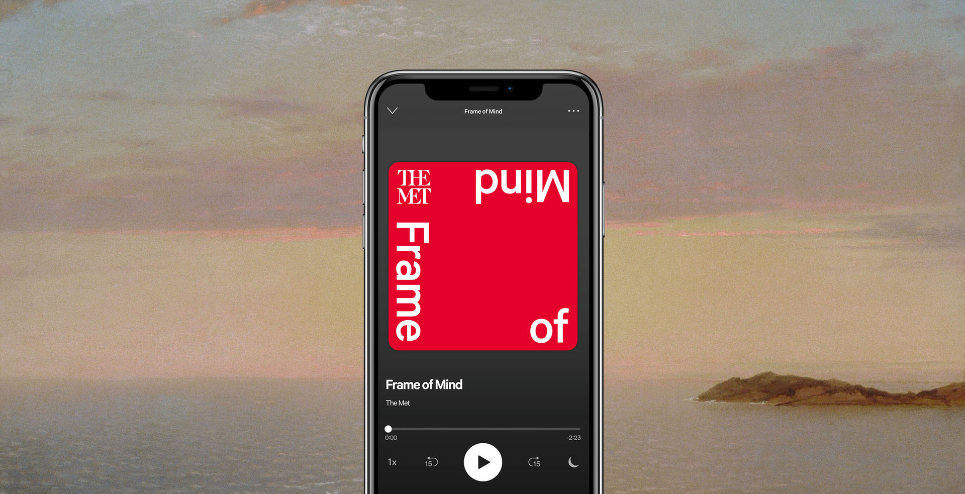 Cellphone showing a red square that reads Frame Of Mind. There is a calm ocean landscape in the background. 