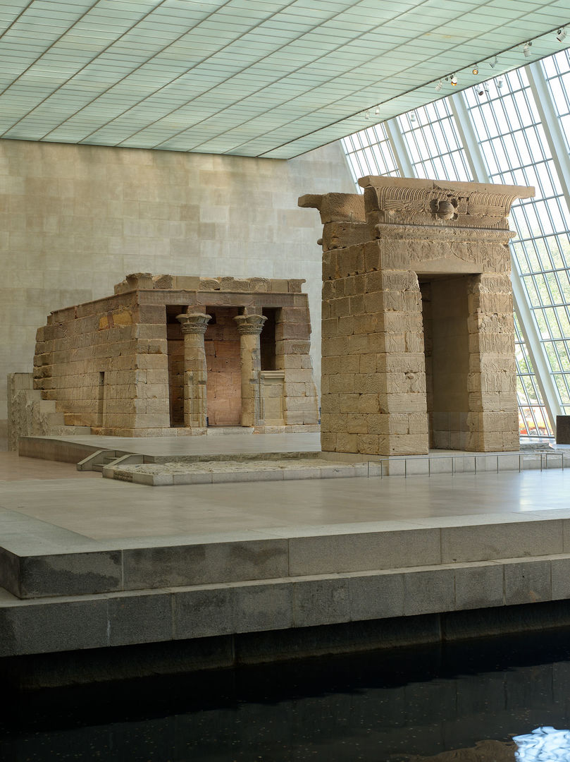 Egyptian Temple of Dendur surrounded by water at the Met museum;