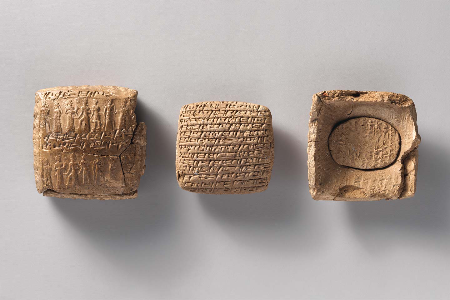 Clay cuneiform tablet with a small second tablet