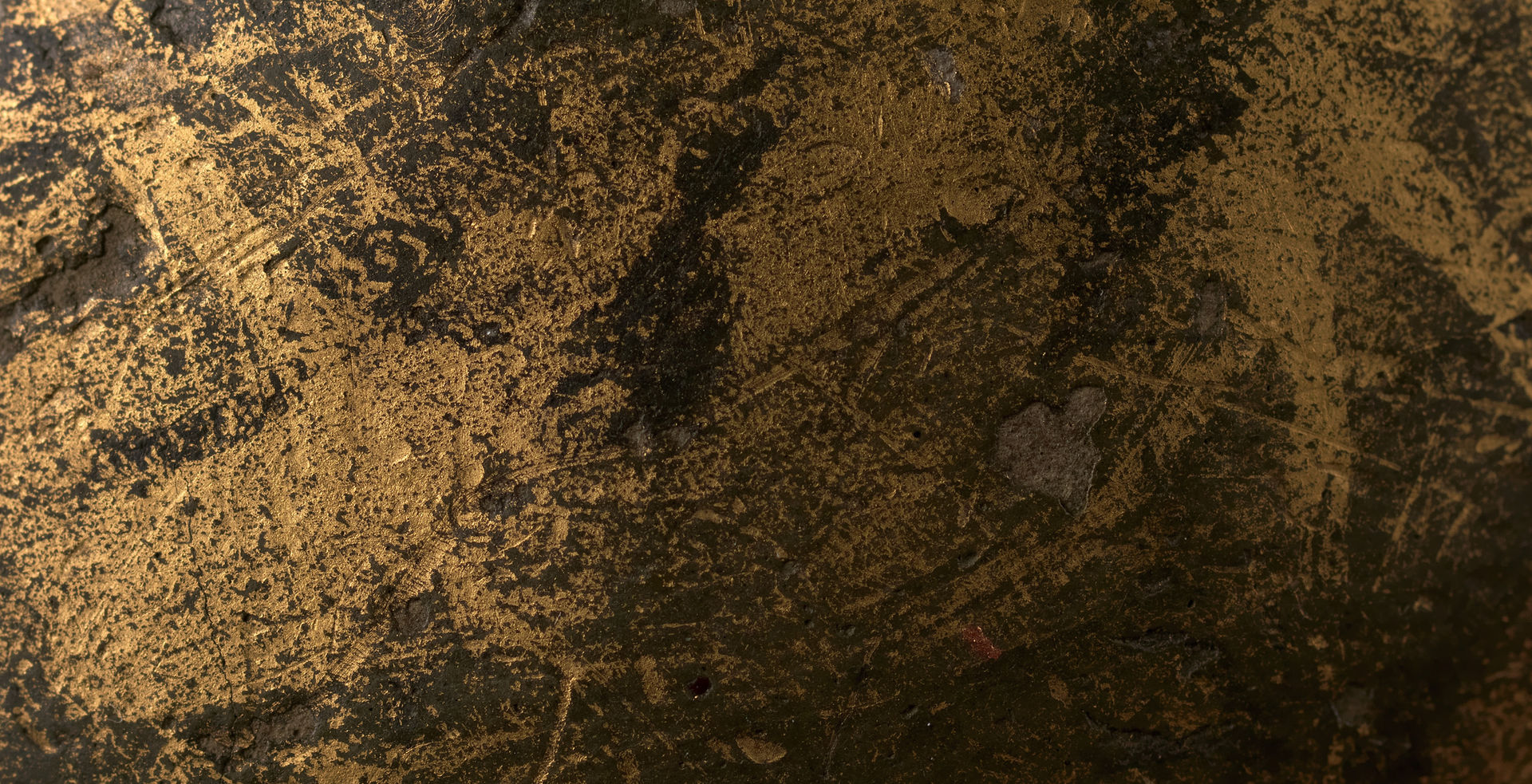 A metallic black and gold texture