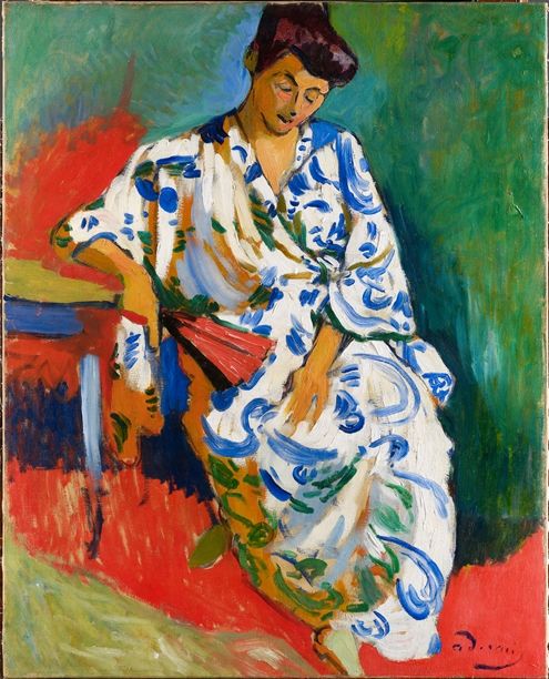 A painting of a woman in a kimono with a fan in her right-hand lounging in a swirl of bright colors