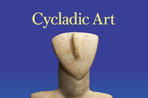 stone sculpture if person in center without facial features with the words "Cycladic Art" above